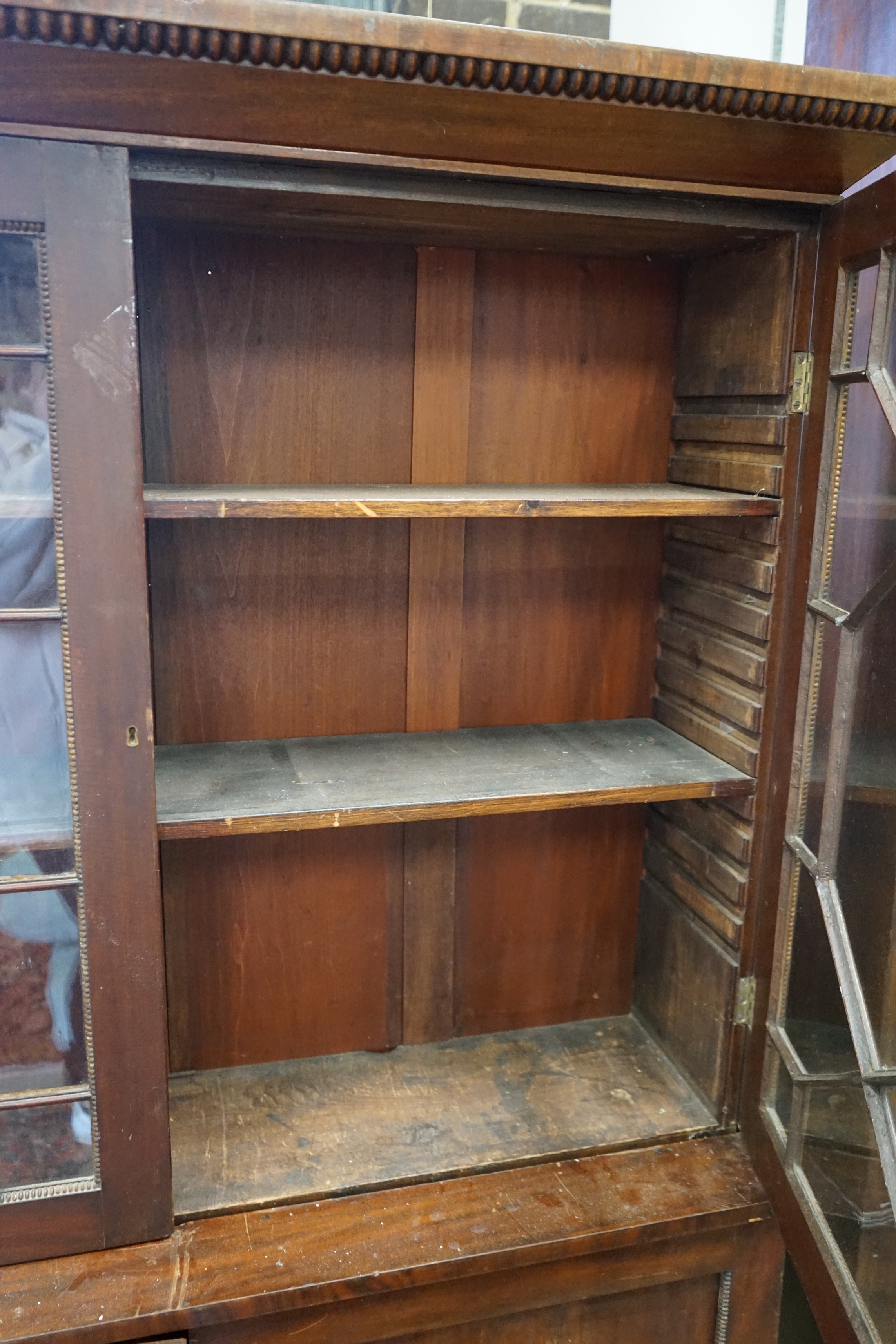 A Victorian mahogany glazed bookcase, width 126cm, depth 34cm, height 169cm